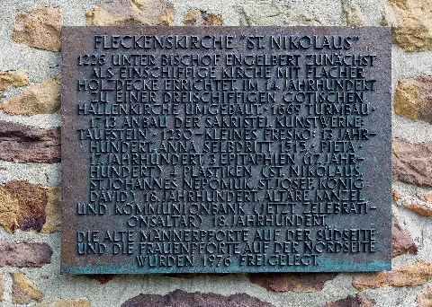 Information tablet at the Roman Catholic St Nicholas Church (Fleckenskirche St. Nikolaus) in Bad Iburg, Landkreis Osnabrück, Lower Saxony, Germany.