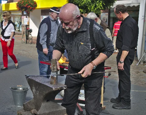 Blacksmith Forging A Candlestick