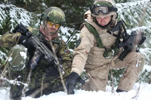 Czech Army Sgt. Van Kmecik And Croatian Army Master Sgt. Bravko Horvat Discuss Patrol Routes