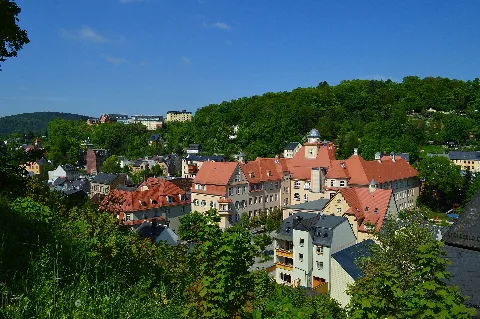 Greiz, Thuringia, Germany, on Whitsunday 2013: View of the town from the driveway towards Oberes Schloss (Upper Castle); in the center the Goethe school at Marienstraße 12/14