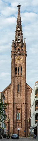 This is a photograph of a cultural monument.It is on the list of cultural monuments of Ludwigshafen am Rhein-Südliche Innenstadt. Designation: Tower of the Protestant Lutherkirche Construction time: 1858–62 Description: Façade with tower of the Neo-Gothic hall Architect August von Voit, Munich 1883 added sculptures by sculptor Moest, Karlsruhe Place: Quarter Mitte, Local district southern city centre, Ludwigshafen am Rhein, Rhineland-Palatinate, Germany Location: Maxstraße House number: 33