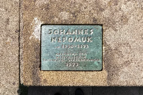 Plaque to the statue of “Johannes Nepomuk” (Rudolf Breilmann, 1993) at the Aa bridge at Bispinghof in Münster, North Rhine-Westphalia, Germany