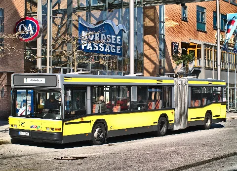 Car #659 of the Wilhelmshaven City Works, a Neoplan N 4018, is waiting for passengers in front of Wilhelmshaven Central Station whilst on route 1 (Central Station → Alt-Voslapp).