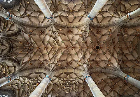 Vertical view into the Gothic choir vault of Saint Michael’s Church in Schwäbisch Hall (Germany).The vault does not look perfectly symmetrical and slightly twisted on the picture. However, this was unavoidable because the vault is not completely symmetrical even in reality due to the complicated architectural history.