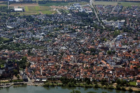Historic old town of Seligenstadt with basilica and palatium on the banks of the Main, view from about 500m altitude. To the right of the picture center the water tower, at the top of the picture the Dudenhöfer Landstraße L3121.