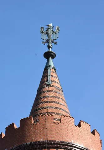 Sculpture of the Brandenburg Eagle on one of the two towers of the Oberbaum Bridge in Berlin, Germany