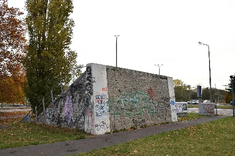 Stone steps at the edge of a green area at the corner of Landsberger Chaussee / Zossener Straße in Berlin-Hellersdorf, Germany.