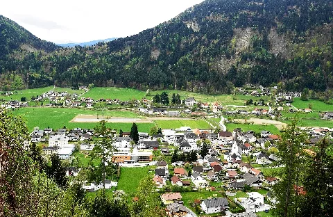 Panoramic view of the market town of Treffen am Ossiacher See, towards mountain of Oswaldiberg (1174 m a.s.l.) district of Villach Land, Carinthia, Austria, EU