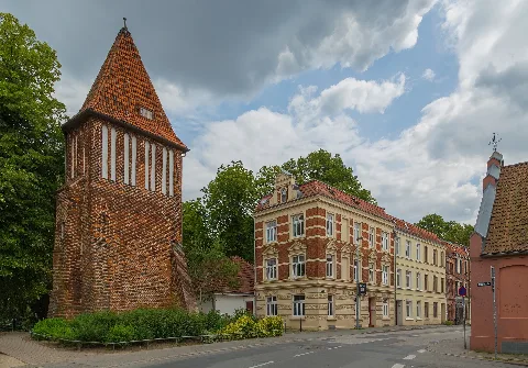 Buildings at the corner of Mill Street (Mühlenstraße) and Builder's Yard Street (Bauhofstraße) in Wismar, Landkreis Nordwestmecklenburg, Mecklenburg-Vorpommern, Germany. Most of the buildings – among them the old water tower on the left-hand side – are listed cultural heritage monuments.